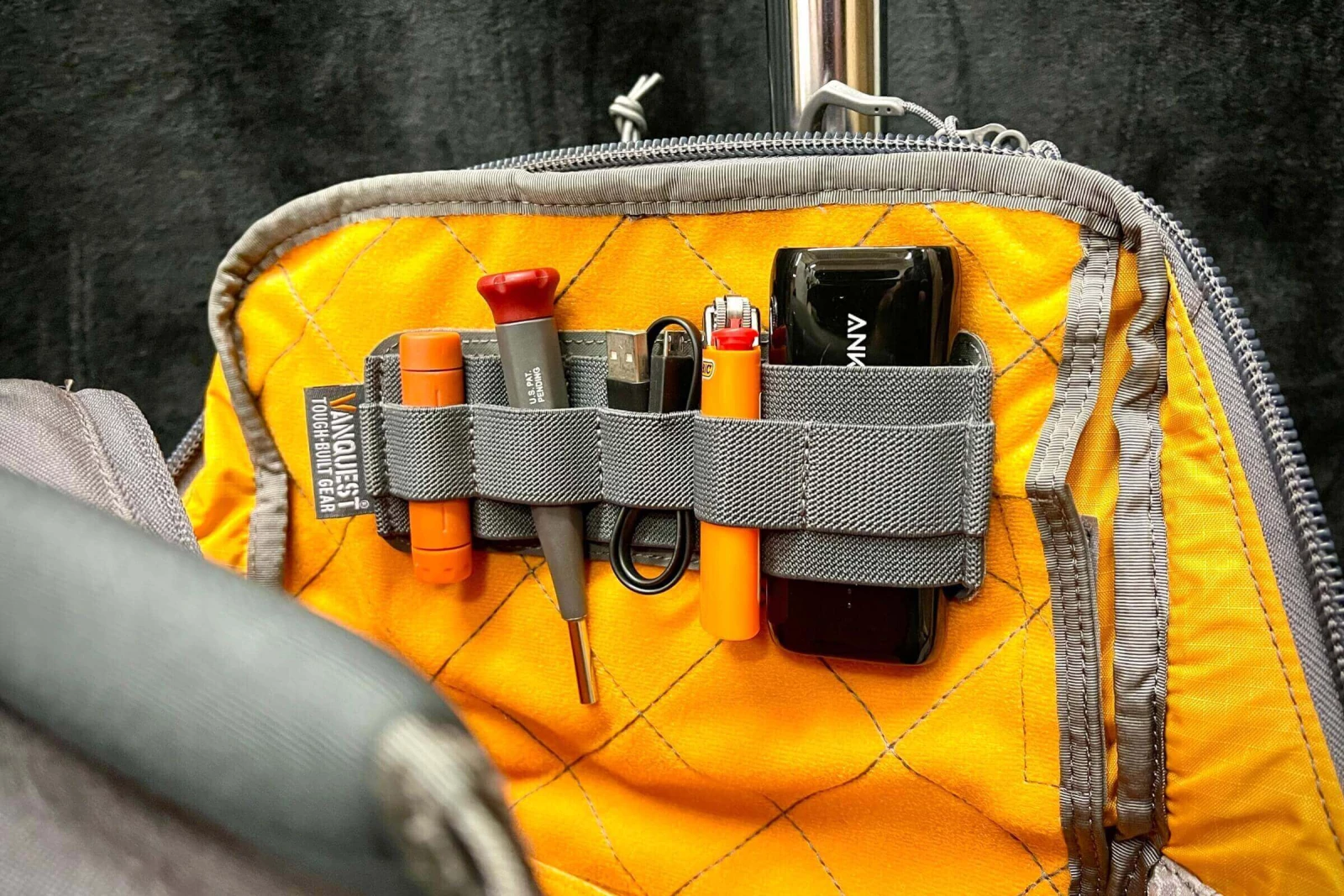 Hook-backed pouches for internal organization.