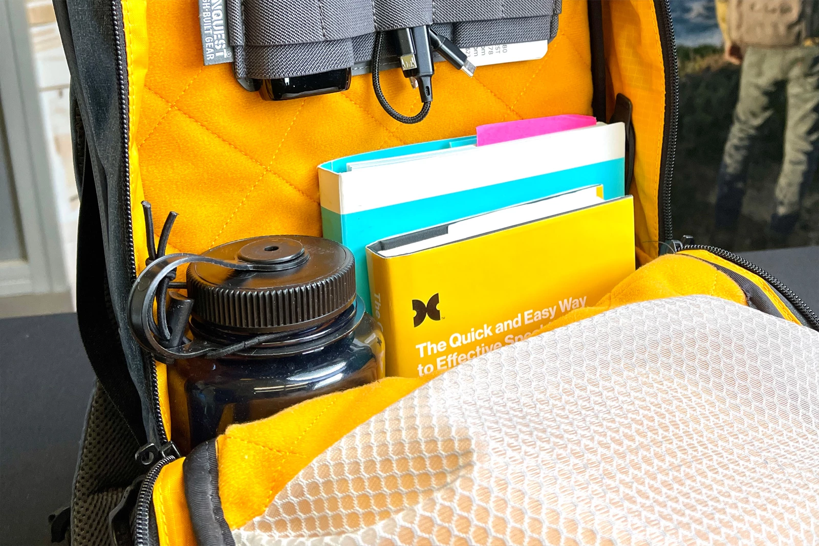Carry water bottles on the inside of your backpack.