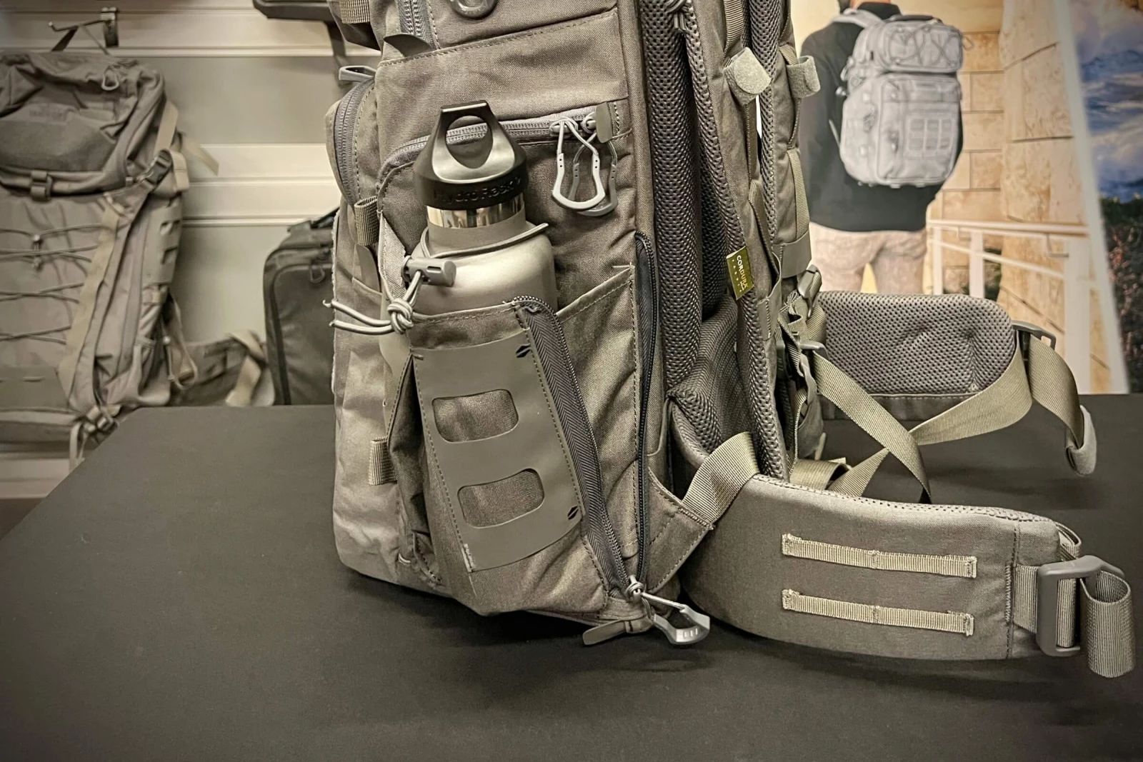 Internal water bottle storage for a sleek, low - profile backpack.